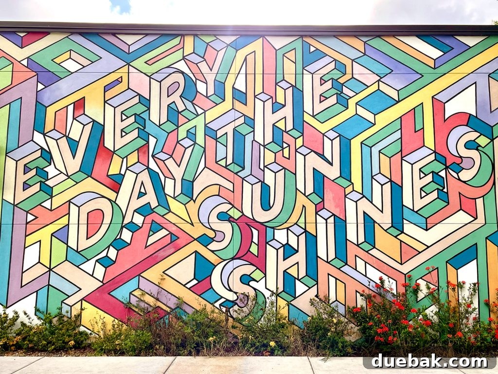 A vibrant 'Every Day The Sun Shines' mural on the side of Pete's Bagels in Saint Petersburg, Florida.