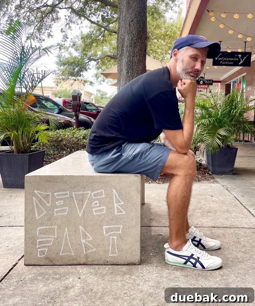 John humorously posing on a 'Never Fart' graffitied bench in Saint Petersburg, Florida.