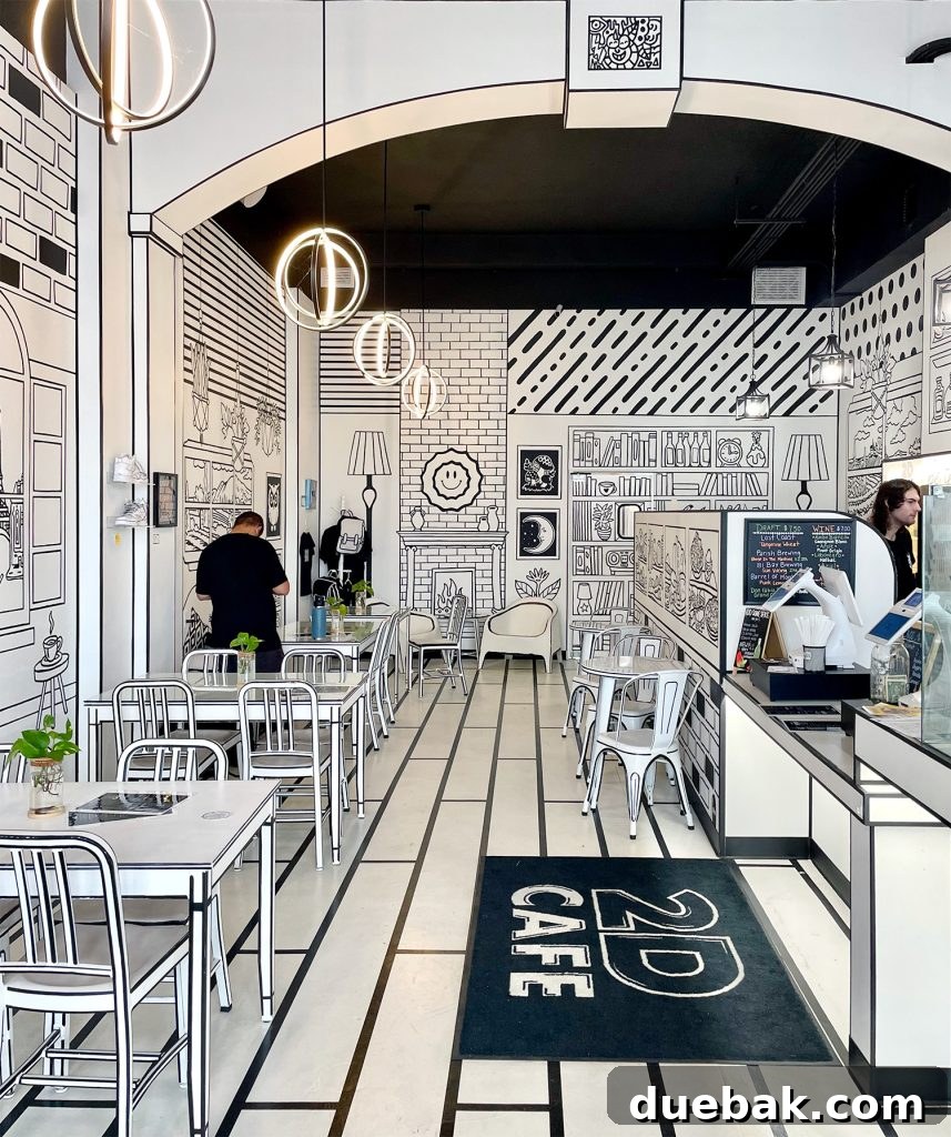 The distinctive black-and-white, hand-drawn interior of 2D Cafe on Central Avenue in Saint Petersburg, Florida.