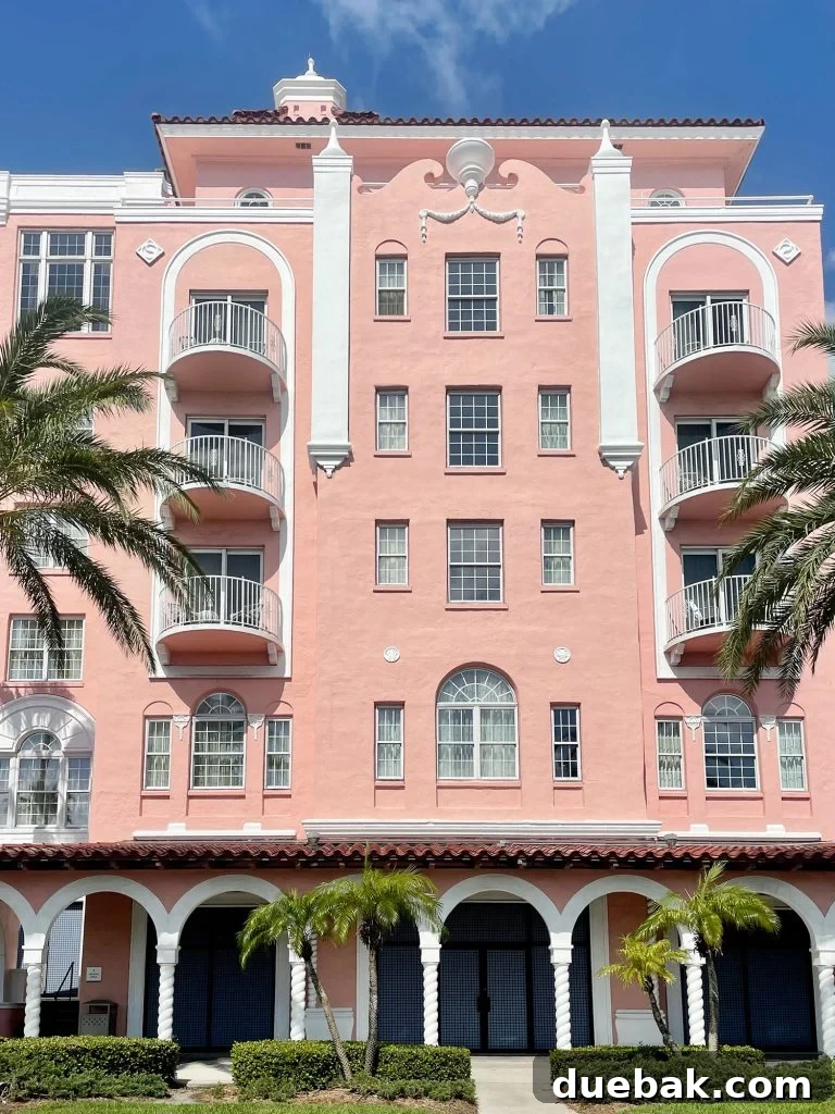 The majestic, iconic pink facade of the Don CeSar Hotel standing proudly in St. Pete Beach, Florida.