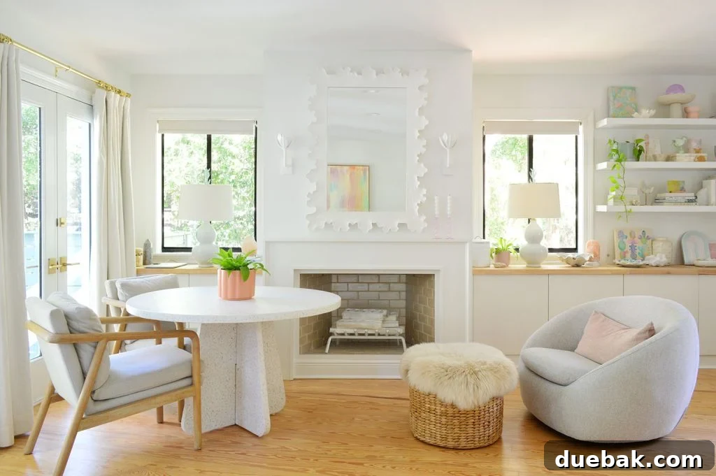 6 Clever Ways We Elevated Our Bedroom 4 Transformed beachy bedroom side with a modern fireplace and stylish terrazzo table