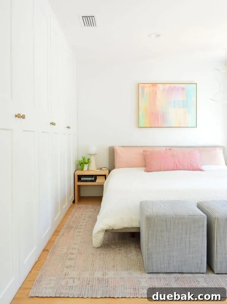 6 Clever Ways We Elevated Our Bedroom 10 Bedroom with a sophisticated wall of built-in Ikea Pax wardrobes seamlessly integrated into the design