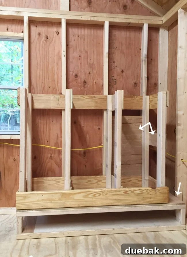 Providing wood backing panels to the scrap wood storage organizer to contain small pieces