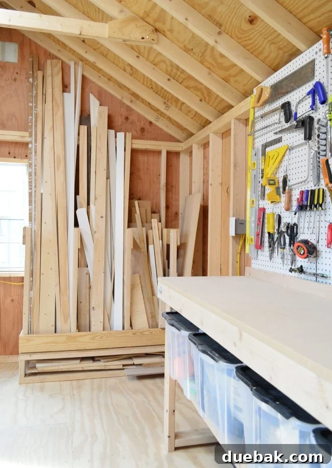Finished scrap wood storage organizer in shed, close-up view of diverse wood pieces
