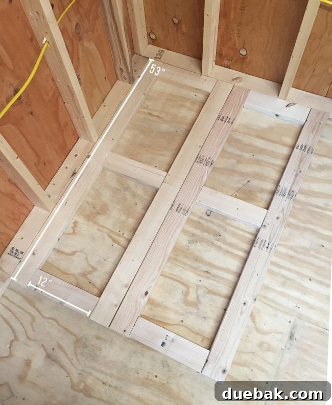 Base of scrap wood organizer being built from 2x4 boards, showing pocket hole construction