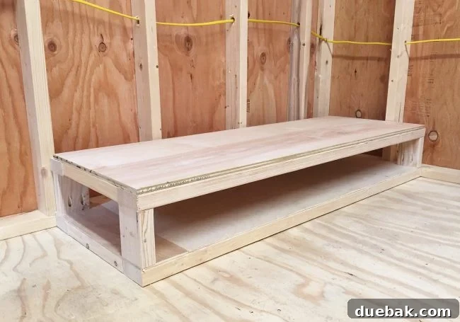 Creating a second flat platform on the bottom of the scrap wood storage organizer with thicker plywood