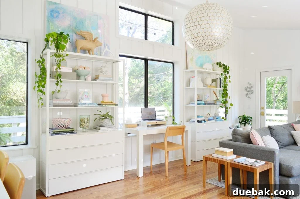 Sherwin Williams Pure White SW 7005 The Ultimate Whole House White 2 Living Room with Sherwin-Williams Pure White walls, featuring plant shelves and natural light.