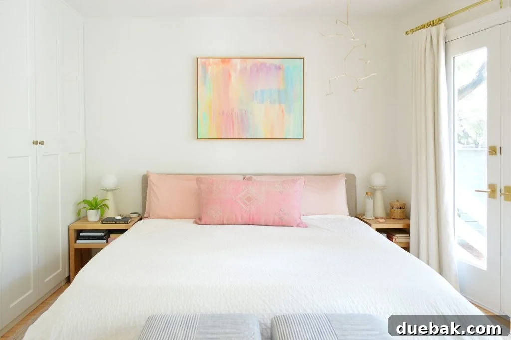 Sherwin Williams Pure White SW 7005 The Ultimate Whole House White 3 Modern bedroom featuring Sherwin-Williams Pure White walls as a backdrop for colorful artwork.