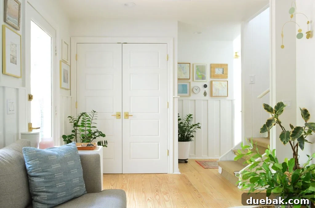 Sherwin Williams Pure White SW 7005 The Ultimate Whole House White 8 Sherwin-Williams Pure White on doors, trim, walls, and ceiling of a cohesive living space.