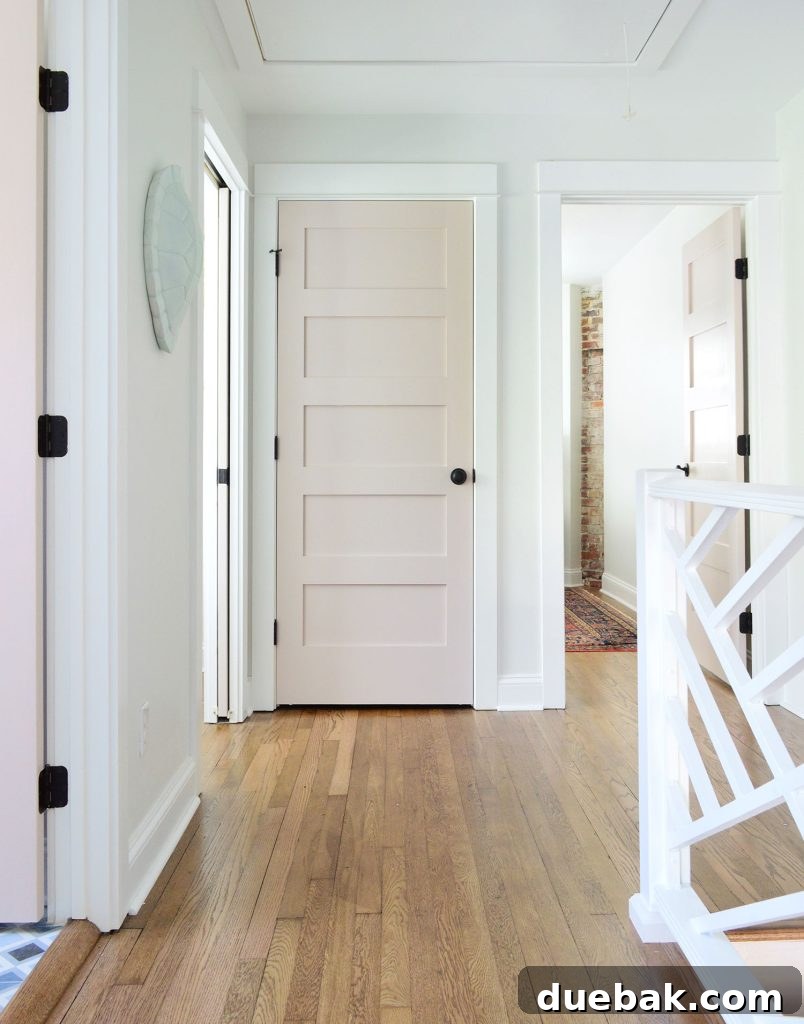 Hallway Upstairs Landing With Pink Doors And Extra White Trim