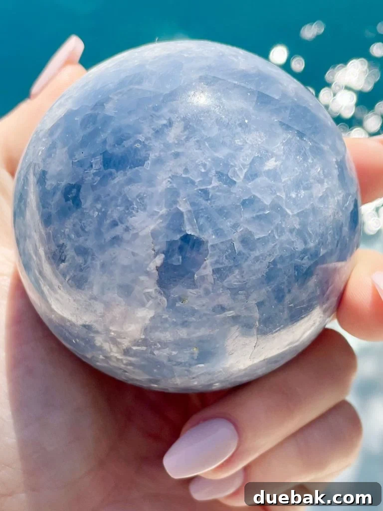 Blue Calcite: Meaning and Metaphysical Properties 6 Blue Calcite Crystal Sphere Over Water