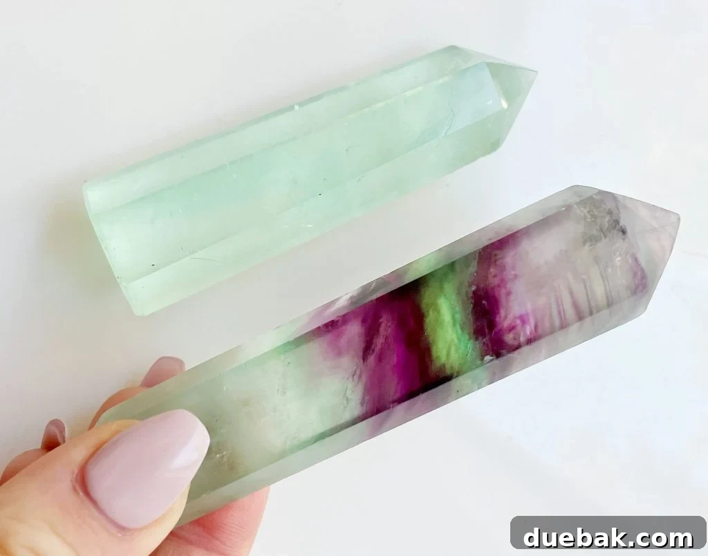 Rainbow Fluorite: Unlocking Its Energy and Purpose 3 Fluorite Crystal Points With Rainbow Banding, displaying natural variations in color and form.