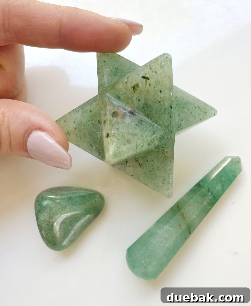 Various shapes of green aventurine crystal including a merkaba asteroid polished stone and polished point