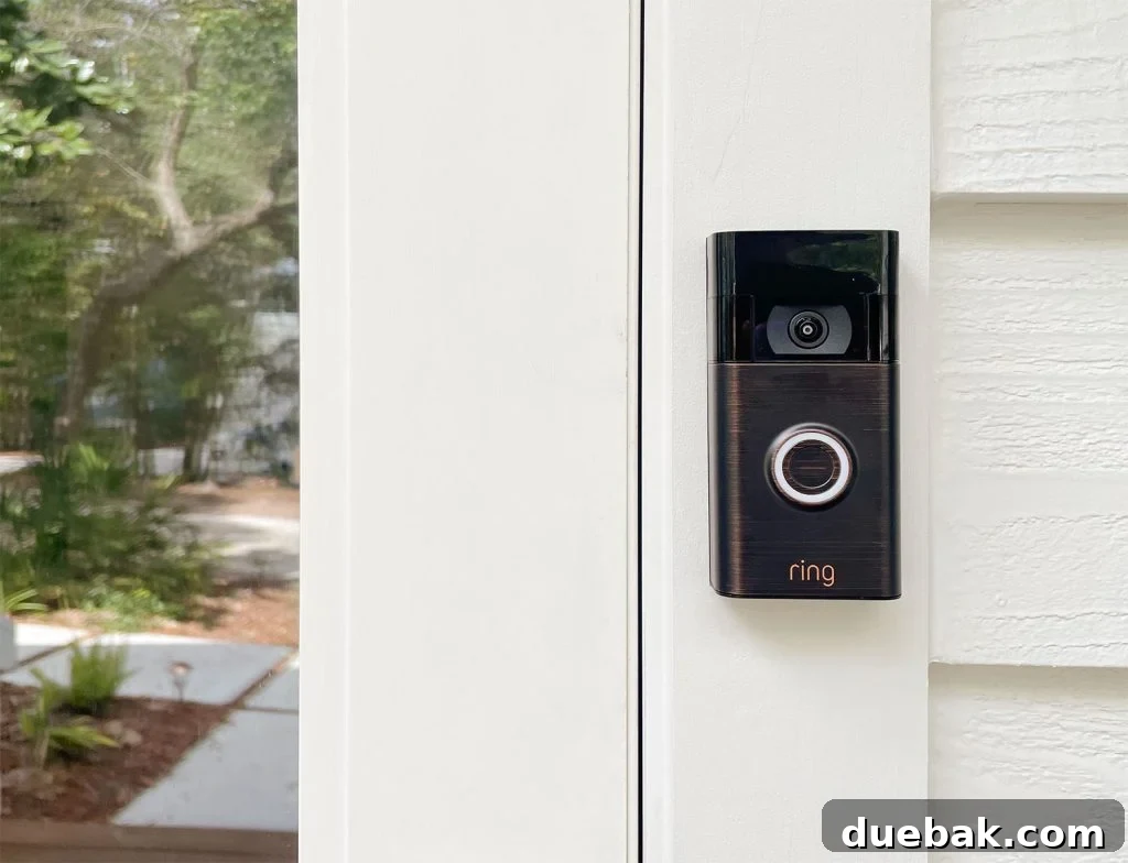 Ring Doorbell Setup Simplified in Five Steps 14 Ring Video Doorbell in Venetian Bronze elegantly installed on a white house, showcasing smart home integration