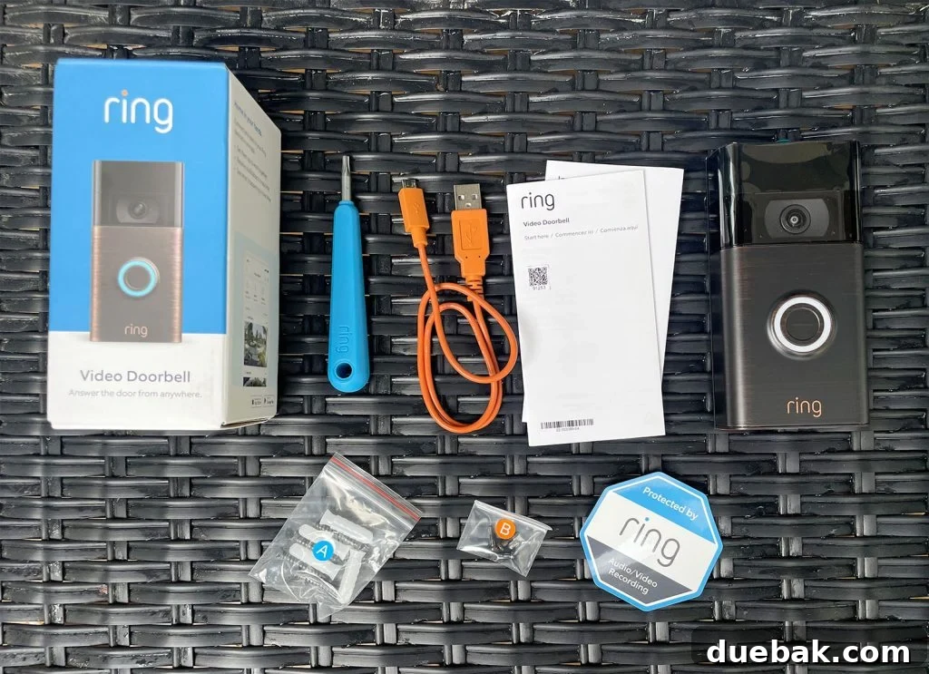 Ring Doorbell Setup Simplified in Five Steps 3 Ring Video Doorbell box contents including screwdriver, charging cord, and mounting screws - Everything you need for a quick DIY installation