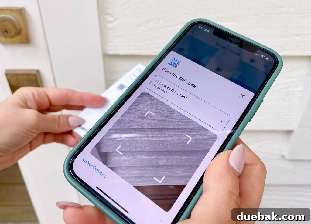 Ring Doorbell Setup Simplified in Five Steps 7 Ring app setup process showing a smartphone scanning a QR code to connect the doorbell