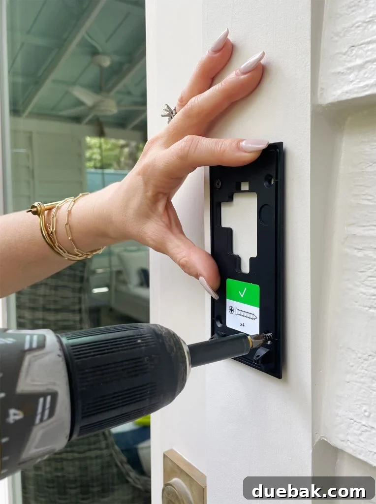 Ring Doorbell Setup Simplified in Five Steps 10 Screwing the Ring Doorbell mounting plate to the front door frame using the provided hardware