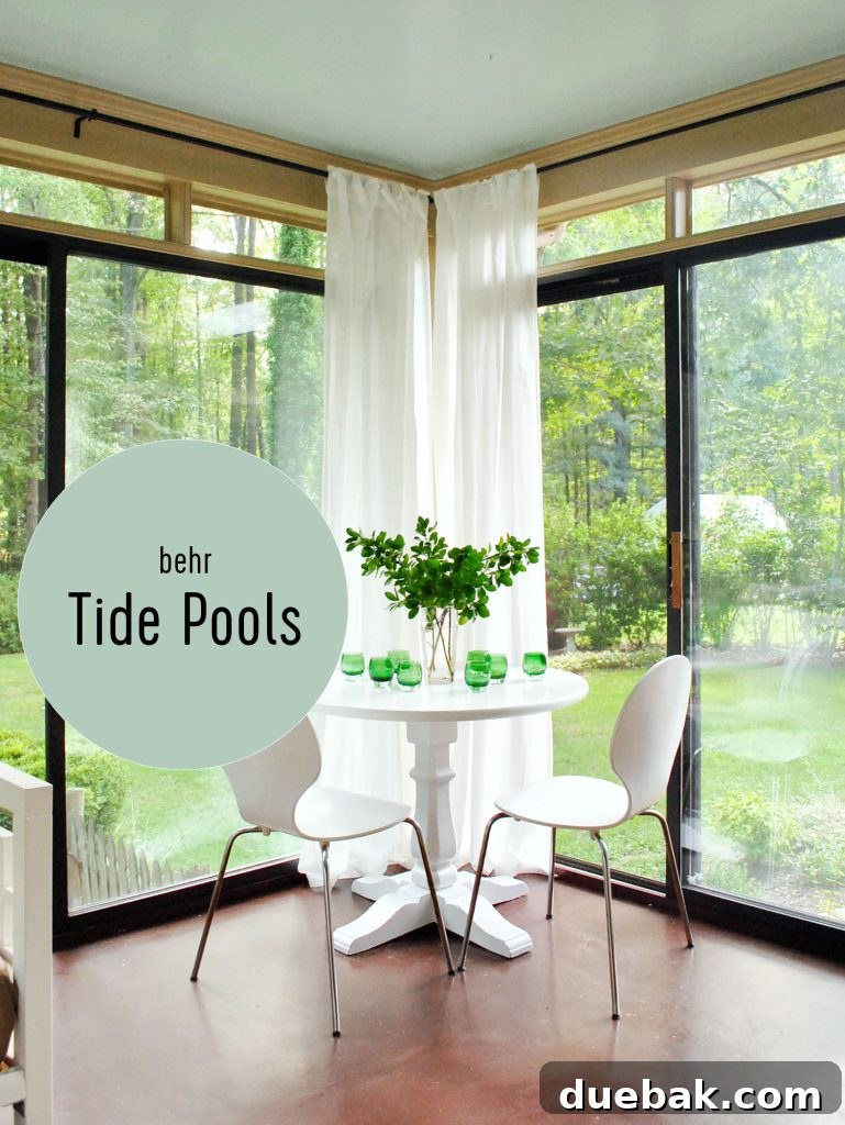 Southern Serenity: Top Haint Blue Paint Shades 11 Sunroom With Haint Blue Ceiling, Behr Tide Pools, showcasing a bolder blue with non-white trim.