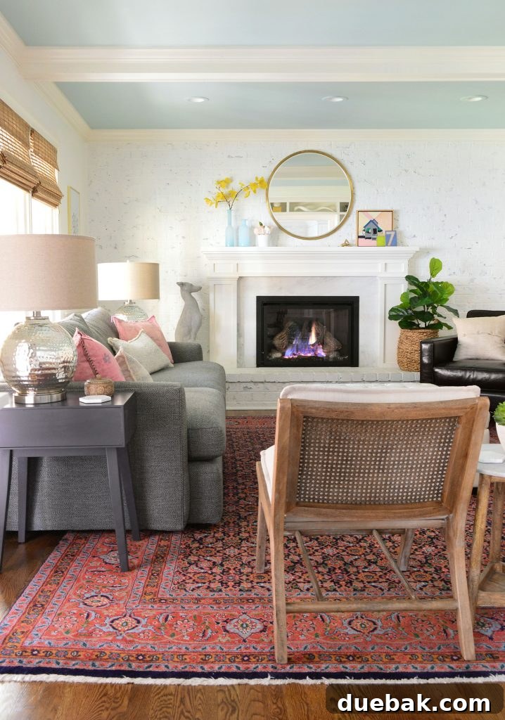 Southern Serenity: Top Haint Blue Paint Shades 6 Interior living room with a Benjamin Moore Galt Blue ceiling, demonstrating the versatility of blue beyond porches.