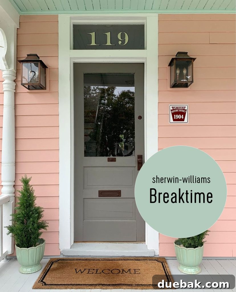 Southern Serenity: Top Haint Blue Paint Shades 9 Haint Blue Ceiling Covered Porch, Sherwin Williams Breaktime shade, complementing a pink beach house.