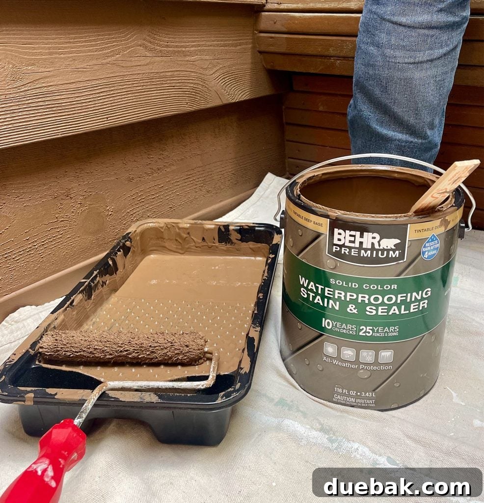 Elevating Your Outdoor Shower with Solid Stain 3 Can Of Behr Premium Solid Color Stain In Tugboat Next To Roller Tray