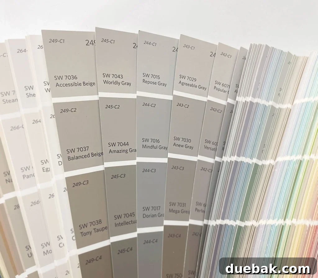 Greige Color Swatches In Sherwin Williams Paint Fan Deck - Demonstrating subtle variations in neutral tones.