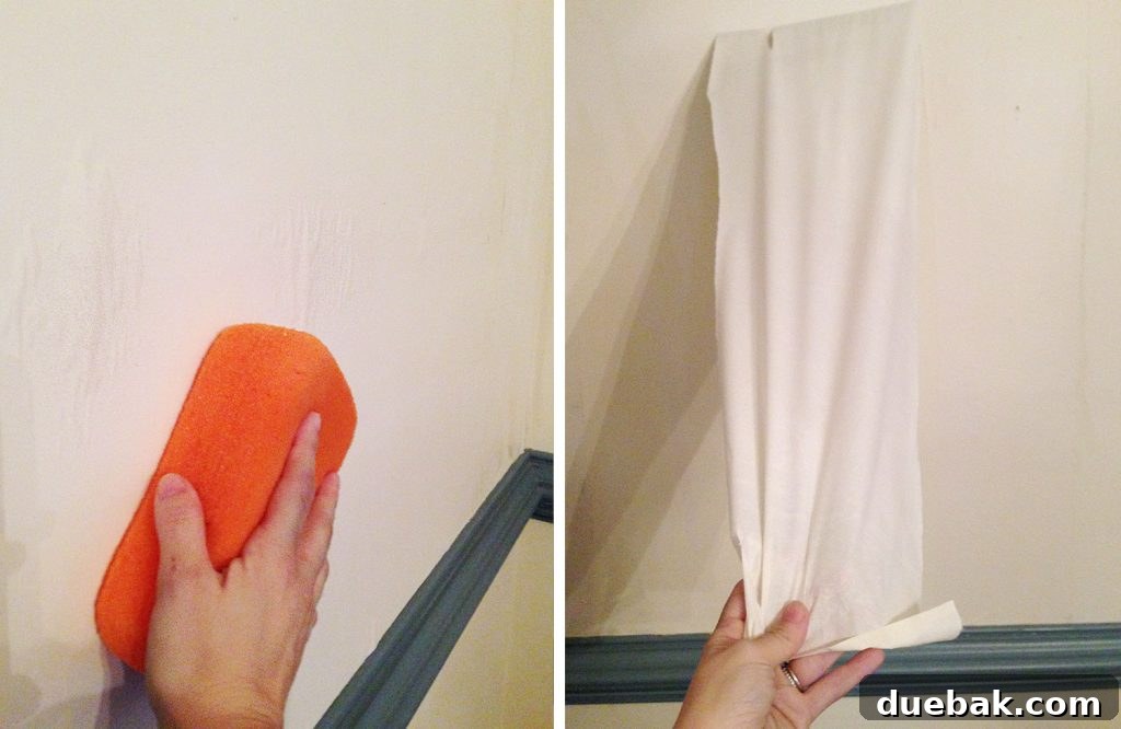 Large Sponge Wiping On Wall To Remove Strip Of Wallpaper Glue