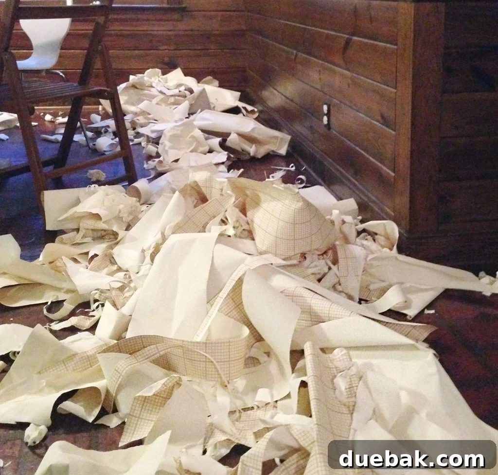 Removed Wallpaper Scraps On Floor Of Kitchen