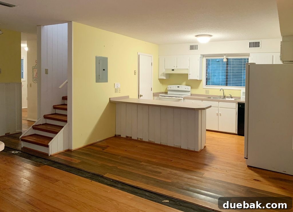 Our Cozy Kitchen-Living Nook 14 Before photo of kitchen with yellow walls and hole in floor