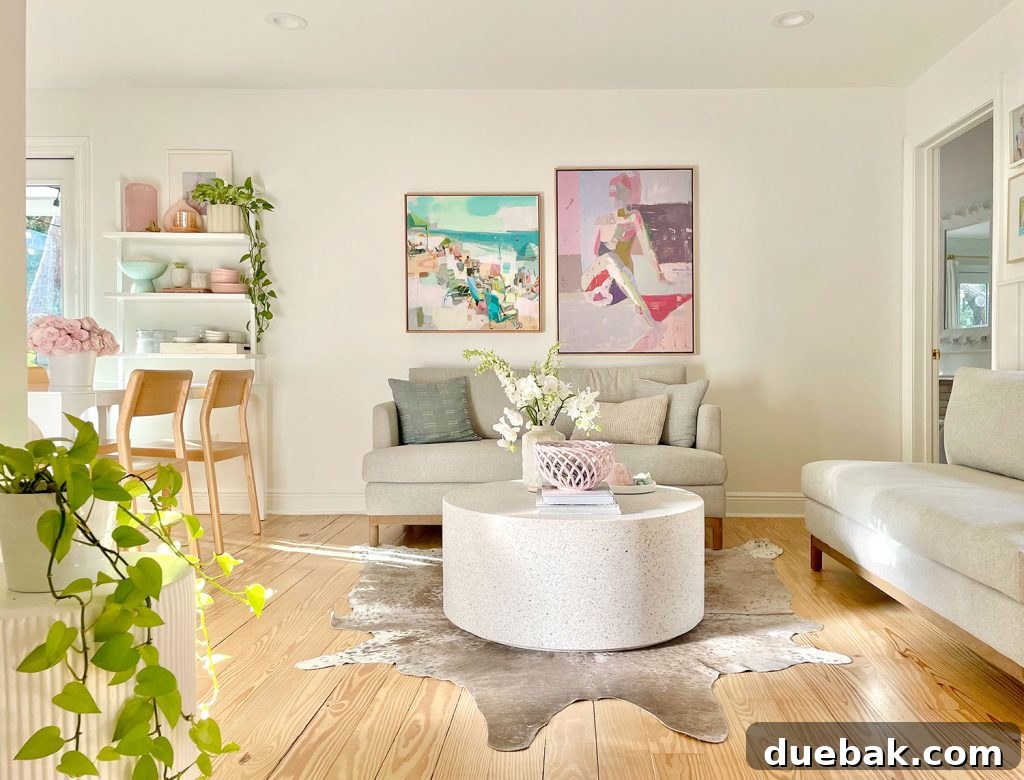 Our Cozy Kitchen-Living Nook 9 Seating Area With Two Gray Loveseat Sofas And Bright Abstract Paintings