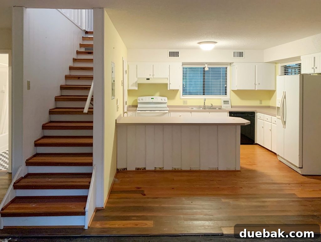 Our Cozy Kitchen-Living Nook 10 Before photo of kitchen with yellow walls and stairs
