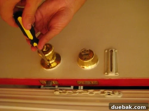 Old Brass Door Knob Outdated brass front door knob and deadbolt before replacement