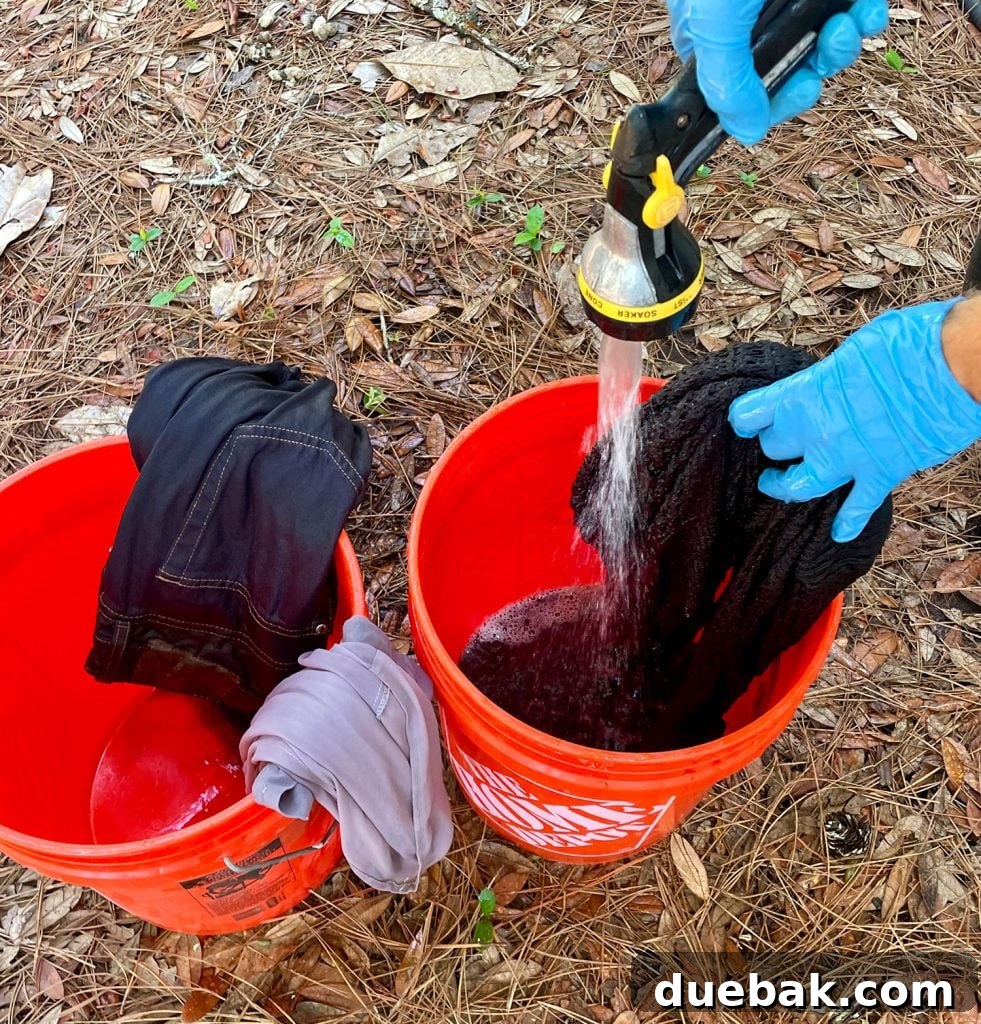 Mastering Fabric Dyeing at Home 14 Rinsing Black Dyed Clothes Of Excess Rit Dye Into Bucket