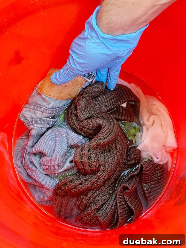 Mastering Fabric Dyeing at Home 7 Pre-wetting clothes to be dyed in bucket