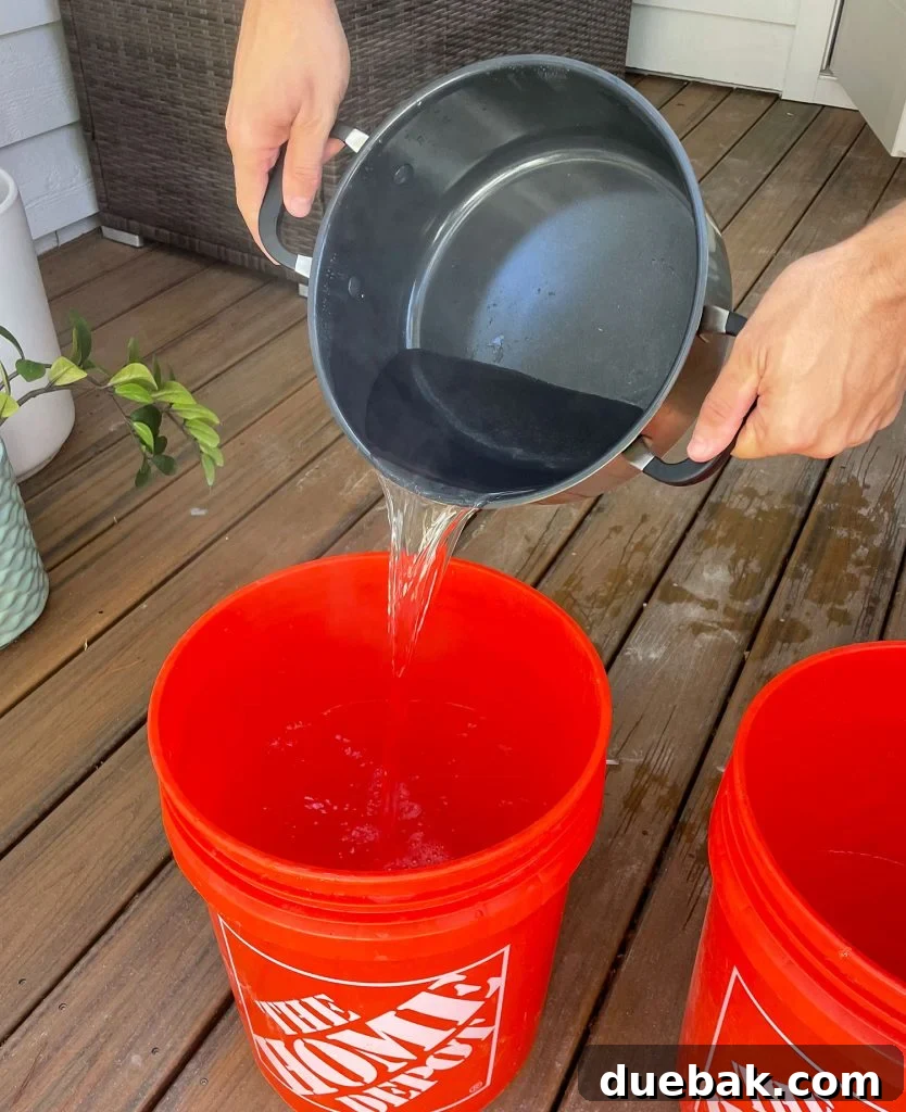 Mastering Fabric Dyeing at Home 8 Pouring Boiling Water Into Bucket For Fabric Dye
