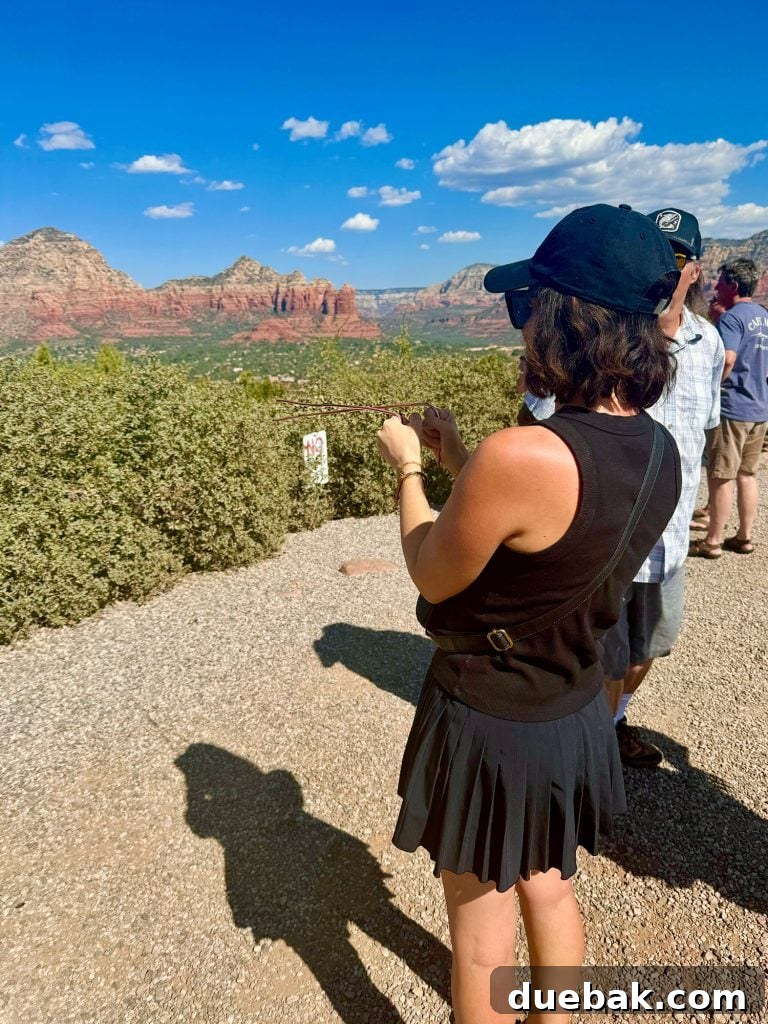 Sedona Sisterhood Sojourn 15 Sherry Holding Metal Poles On Vortex Tour In Sedona Arizona