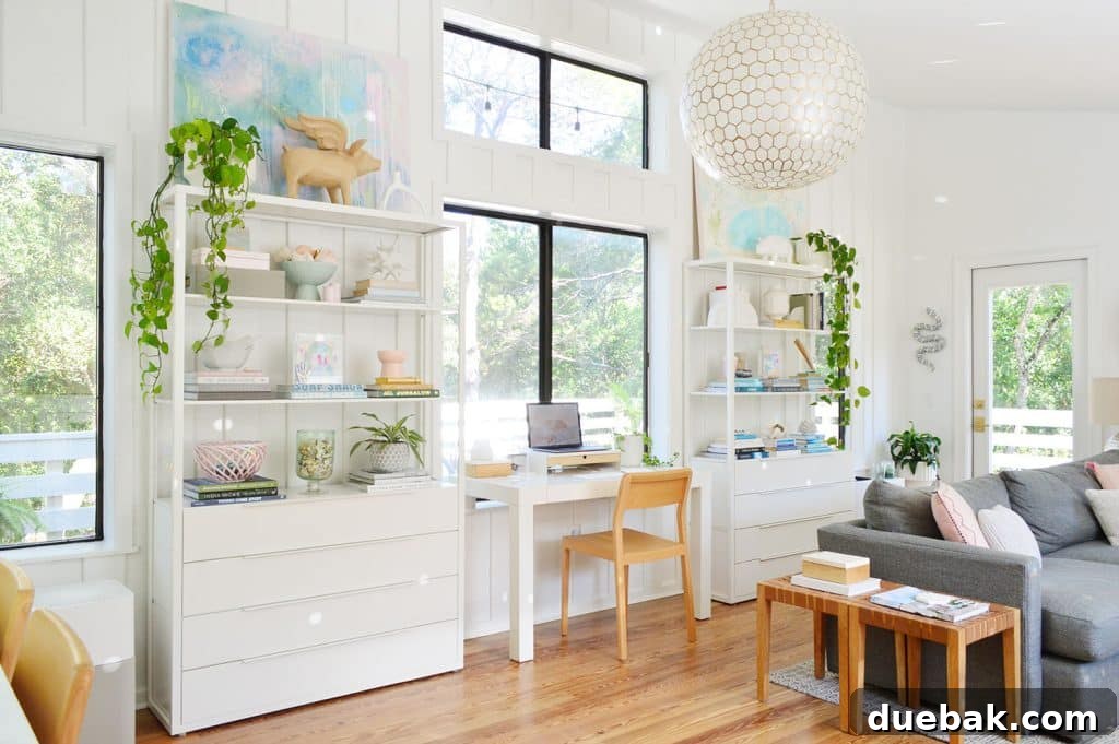Light-filled upstairs family room with IKEA shelving and a West Elm Parsons desk, showcasing functional small space design