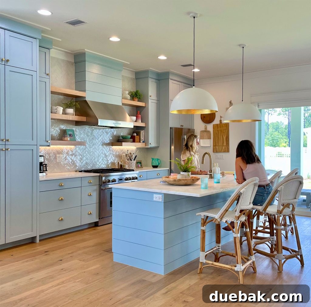 Sherry and a friend sharing a moment in a spacious, modern kitchen
