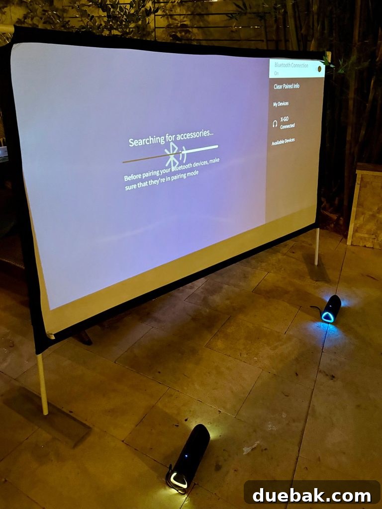 Bluetooth Pairing Wireless Speakers to Outdoor Movie Projector - Steps on screen illustrating how to connect wireless speakers to the projector.