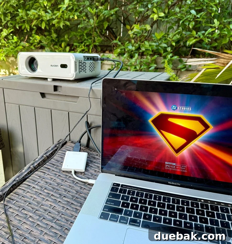 Laptop Connected To Outdoor Movie Projector via HDMI adapter - Illustrates connecting a laptop to the projector for broader streaming options.