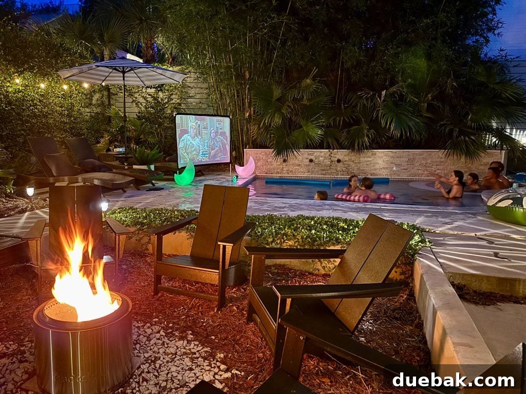 Backyard Pool Area With Firepit And Outdoor Movie Screen - A versatile backyard setup showing a pool, firepit, and an outdoor movie screen.