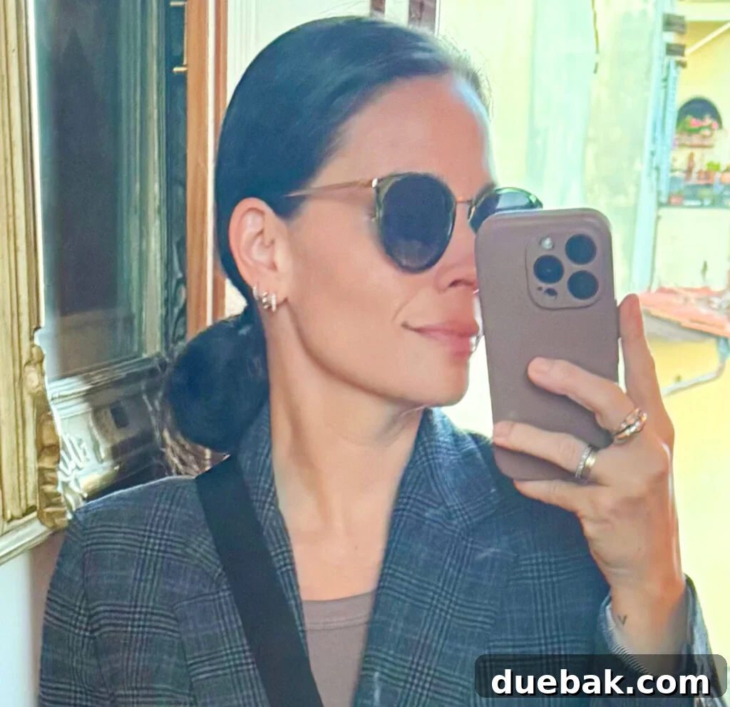 Travel Light to Italy My Ultimate Packing Secrets 10 Sherry Mirror Selfie In Outfit For Italy Zoomed In Tweed Blazer Green Sunglasses - Everyday Earrings