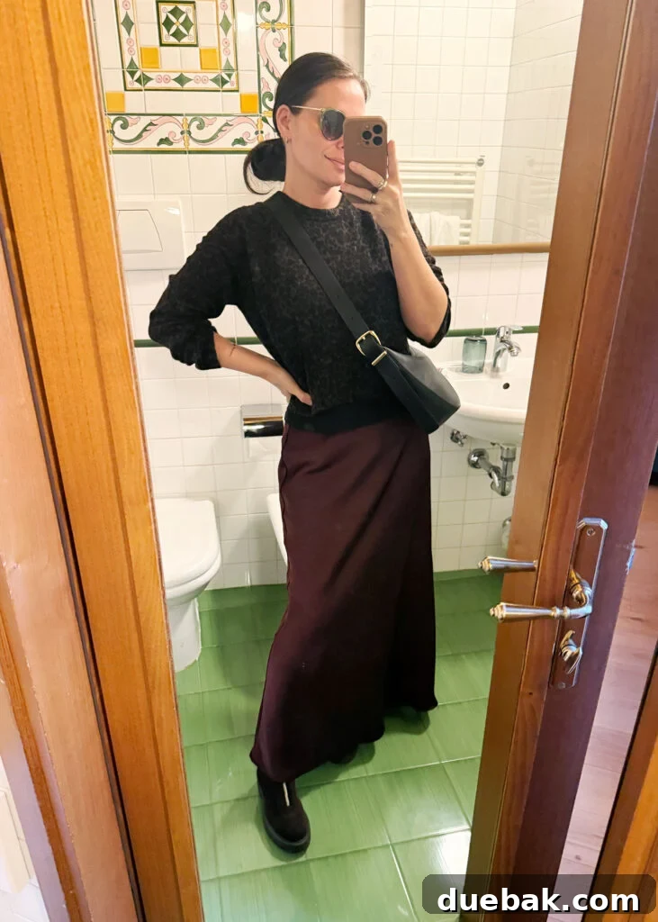Travel Light to Italy My Ultimate Packing Secrets 12 Sherry Selfie In Hotel Mirror In Florence Italy With Wine Skirt And Leopard Sweater - Silk Skirt Comfort