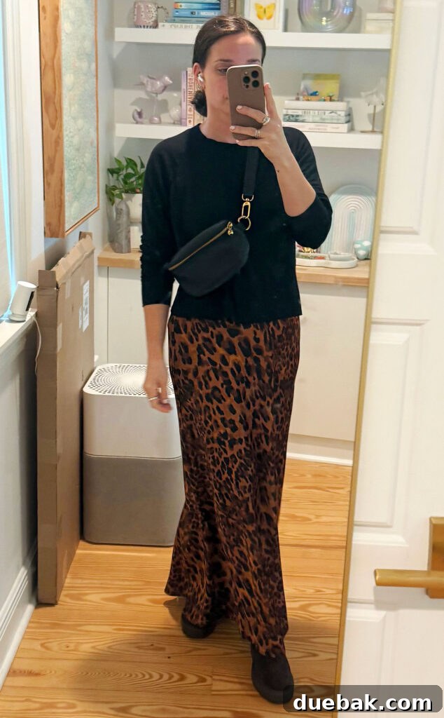 Travel Light to Italy My Ultimate Packing Secrets 13 Sherry Mirror Selfie In Outfit For Italy Black Sweater Leopard Maxi Skirt - Versatile Travel Style