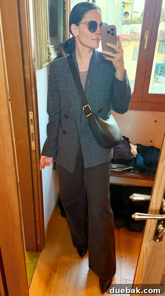 Travel Light to Italy My Ultimate Packing Secrets 14 Sherry Mirror Selfie In Outfit For Italy Tweed Blazer Brown Pants - Cohesive Wardrobe