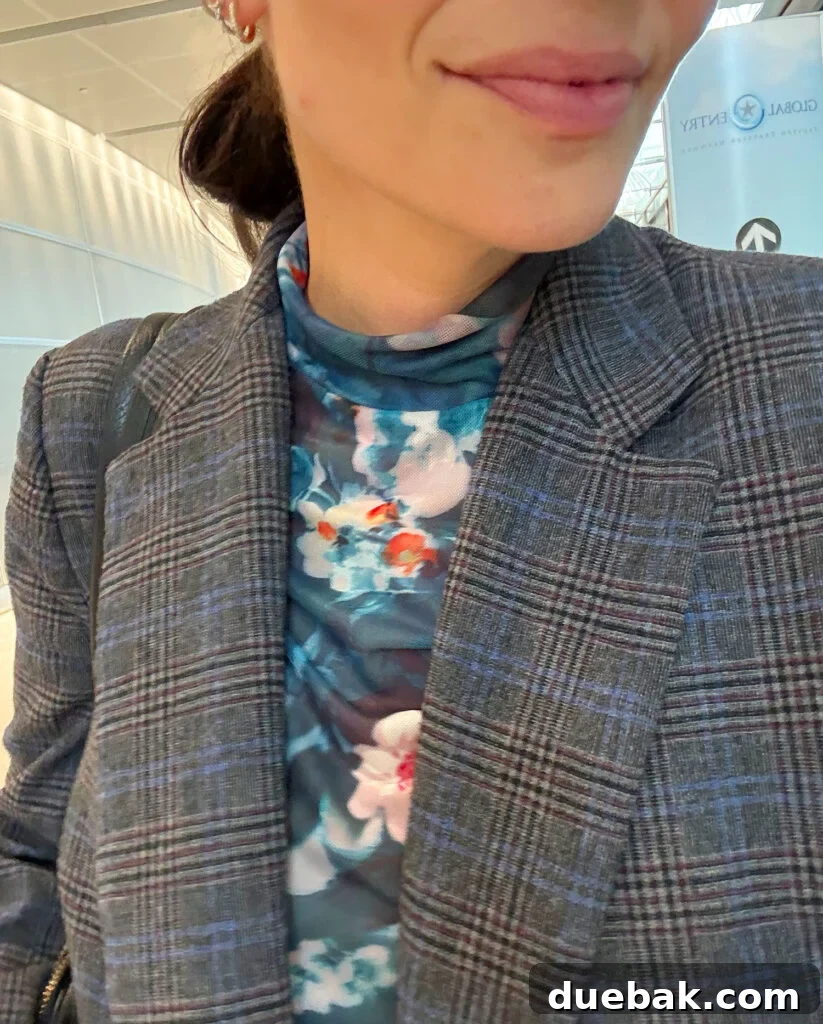 Travel Light to Italy My Ultimate Packing Secrets 7 Close Up Of Floral Mesh Shirt Under Tweed Blazer - Stylish Layers