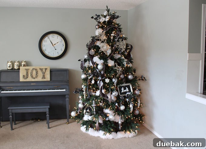 Christmas Tree decorated with faux snow from dollar store feather dusters