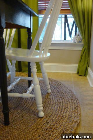Transform Your Kitchen with Painted Wood Cabinets 6 After kitchen dining area with round jute rug under black and white table