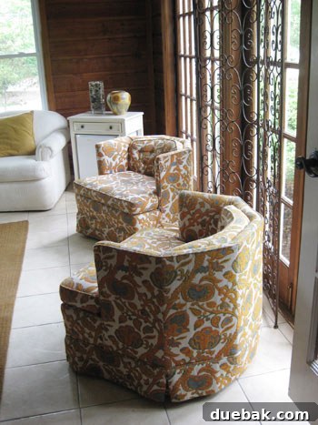Stunning Richmond Transformation 4 Vibrant vintage honeycomb chairs in navy, orange, and white upholstery, adding a pop of retro color and comfort to the game room's design.