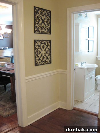 Stunning Richmond Transformation 5 Elegant hallway showcasing crisp chair rail molding and clean white trim, enhancing the architectural integrity and polished feel of the historic home.